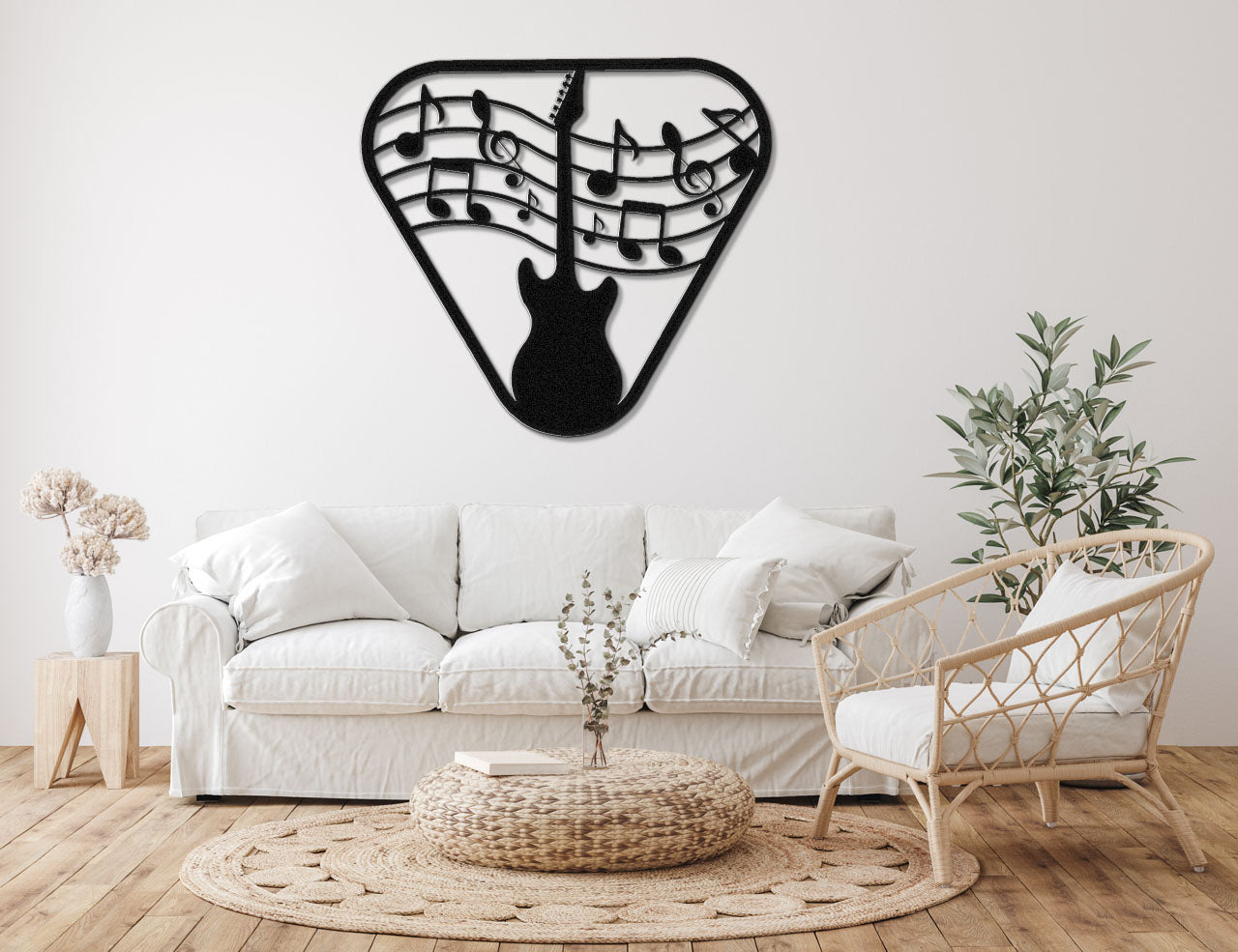 a living room with a white couch and a guitar wall clock