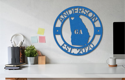 a white desk with a computer and a blue sign on it