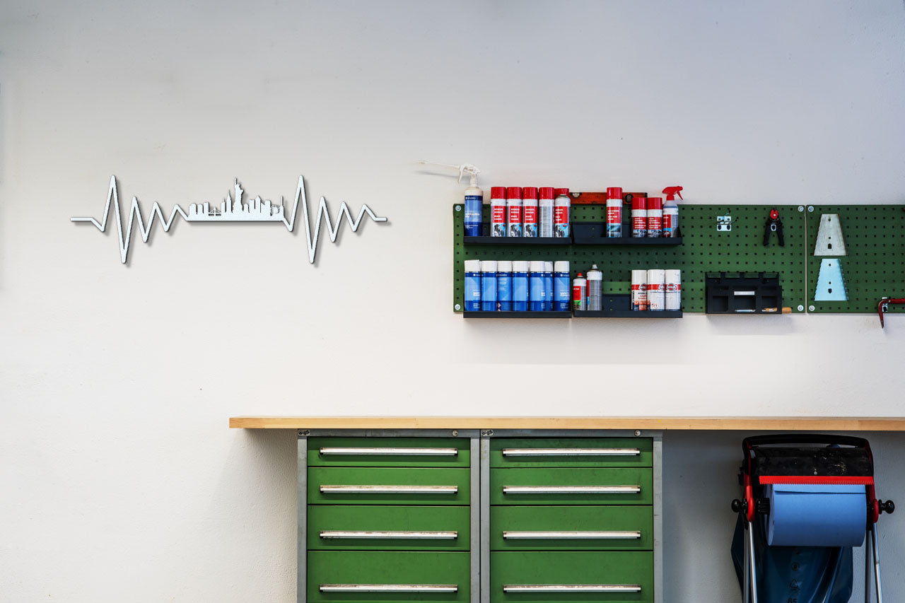 a wall with a green cabinet and a green wall with a stethoscope