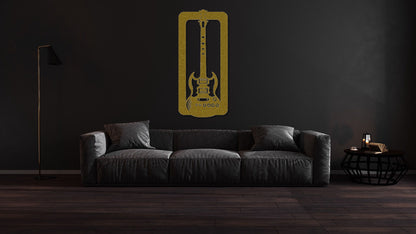 a living room with a couch and a guitar wall decal