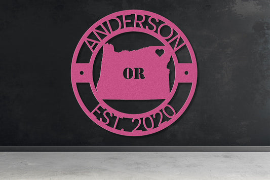 a pink sign on a black wall that says anderson or est 2020