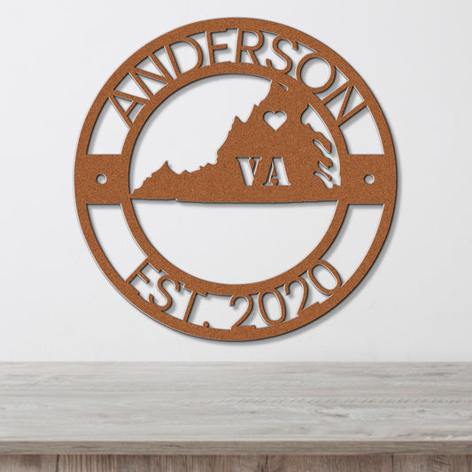 a metal sign with a mountain on it