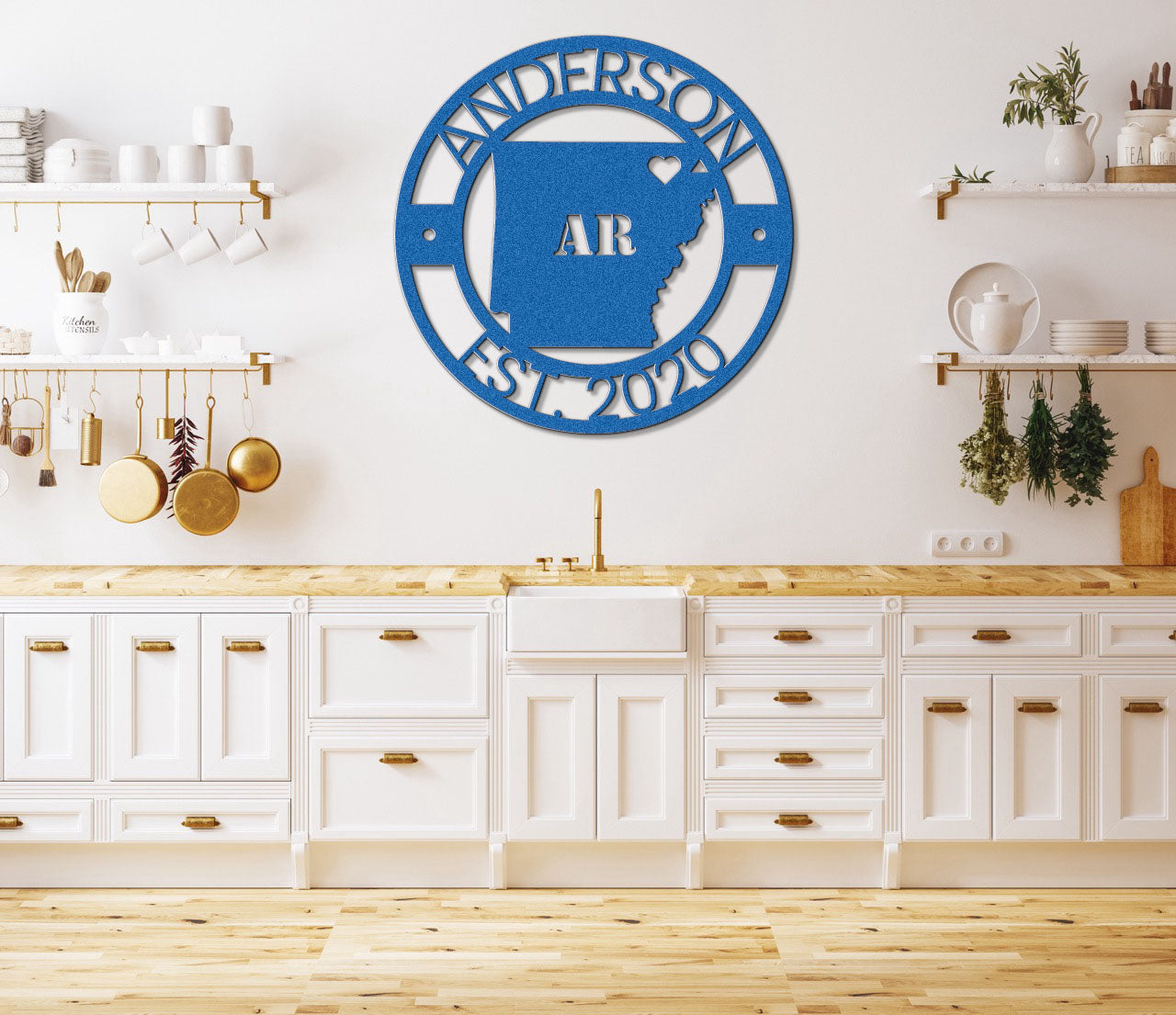 a kitchen with white cabinets and a blue sign on the wall