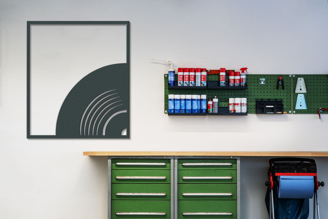 a garage with a green cabinet and a green toolbox