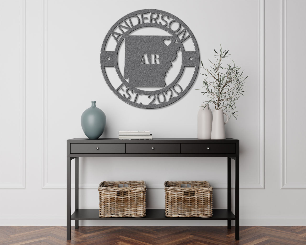 a black table with a basket and a vase on top of it