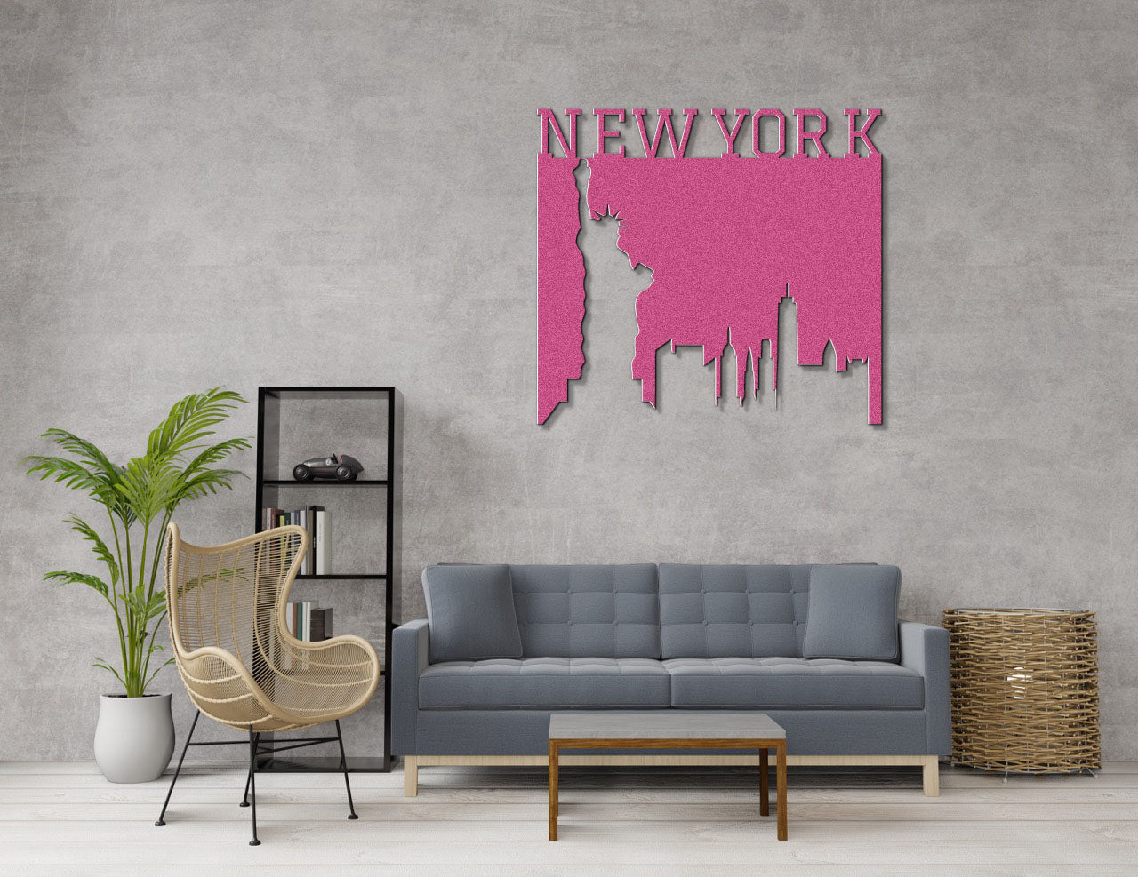 a living room with a gray couch and a pink wall