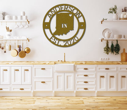 a kitchen with white cabinets and a large metal clock