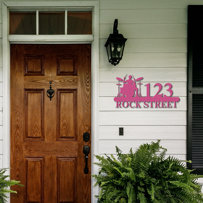 a wooden door with a pink rock street sign on it