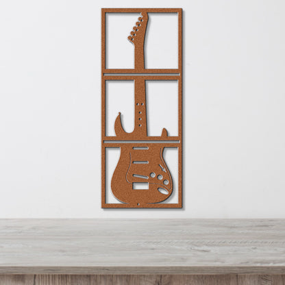 a guitar cut out of wood sitting on top of a table