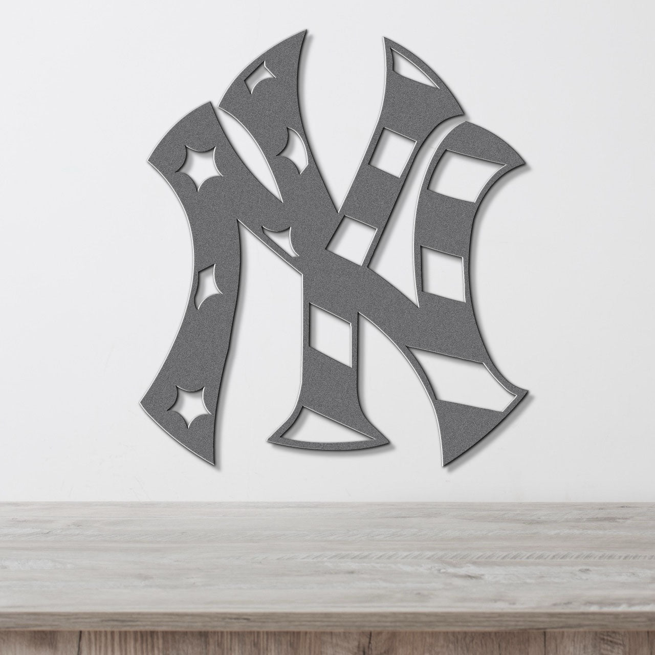 a metal wall sculpture of the new york yankees