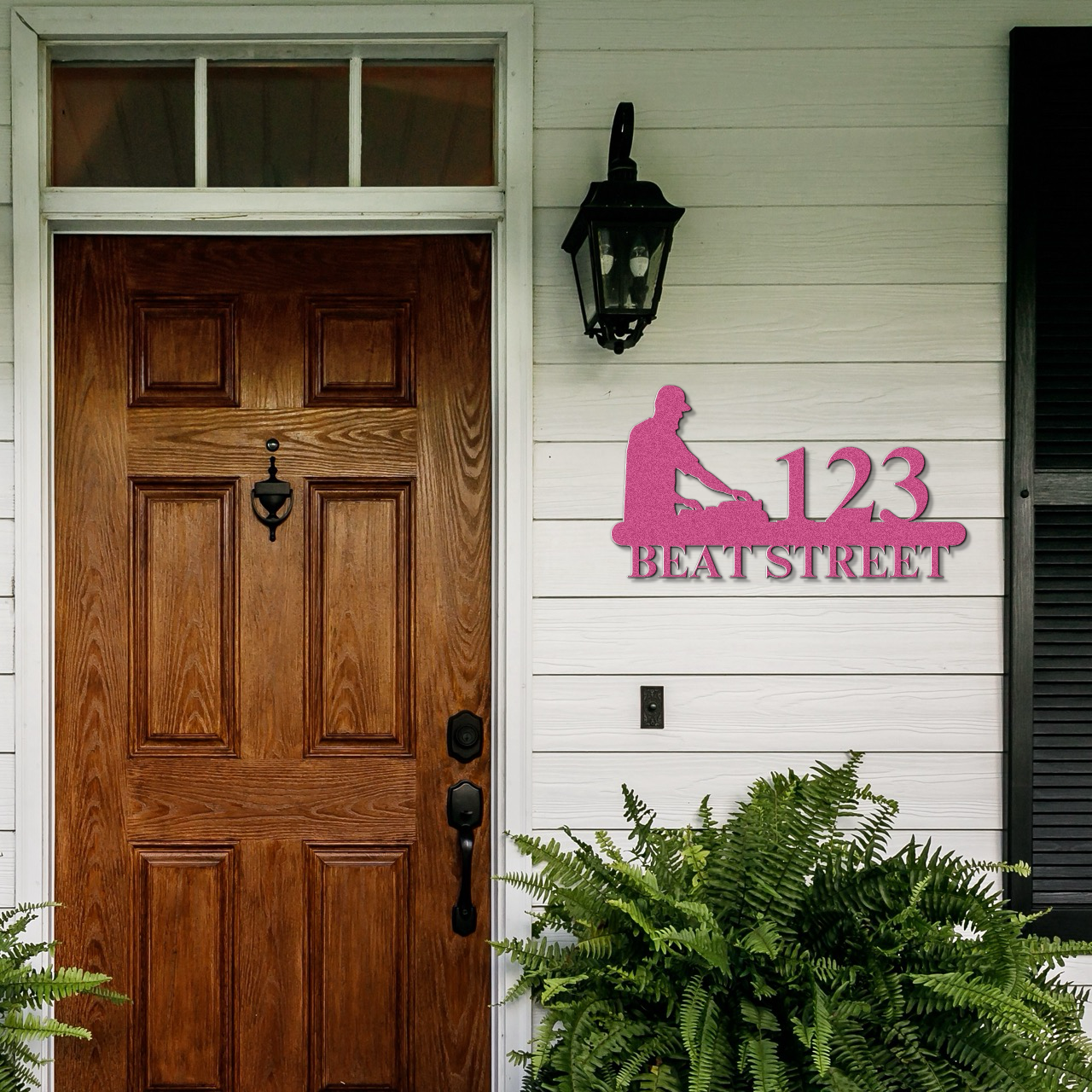 a wooden door with a pink sign on the side of it