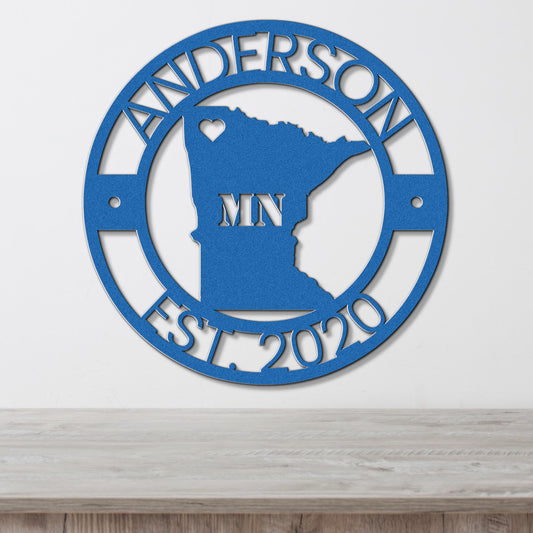 a metal sign with the state of minnesota on it