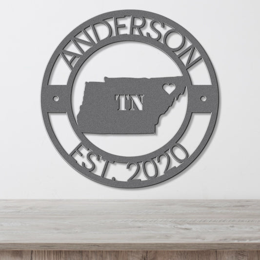 a metal sign with the state of tennessee on it