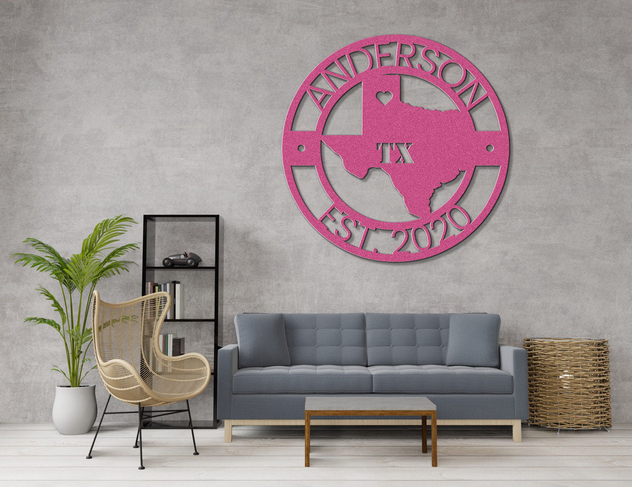 a living room with a gray couch and a pink wall clock