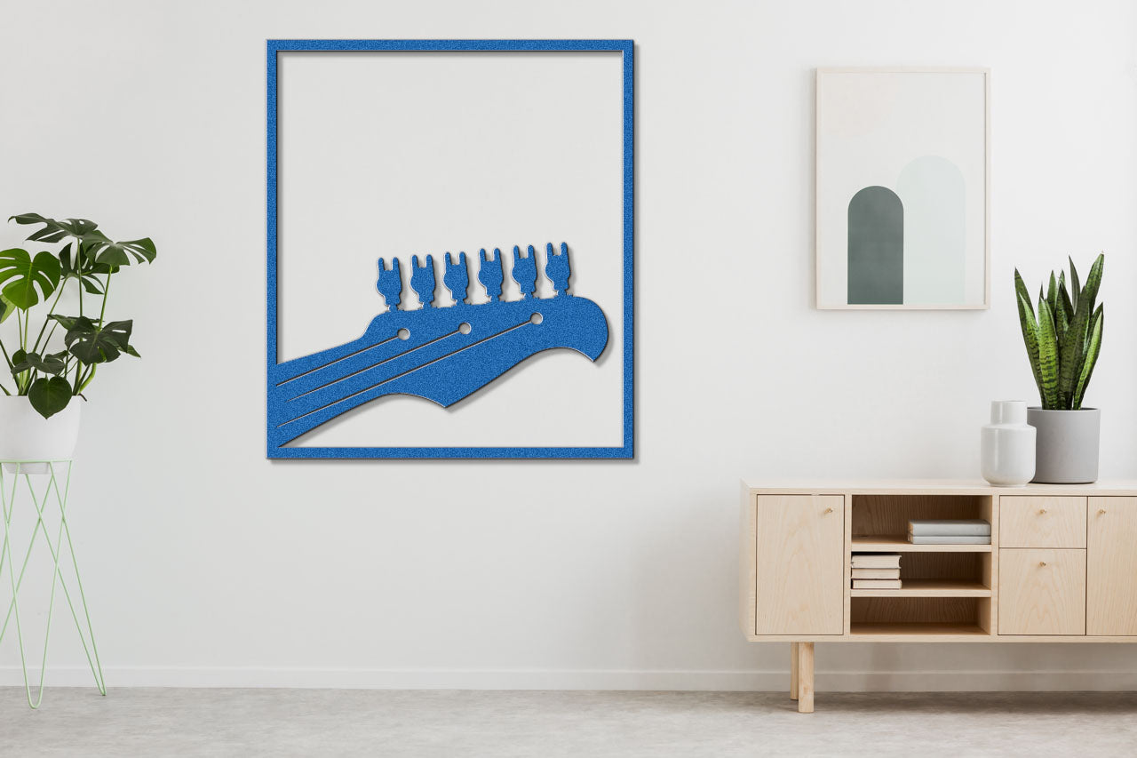 a picture of a blue guitar bridge on a white wall