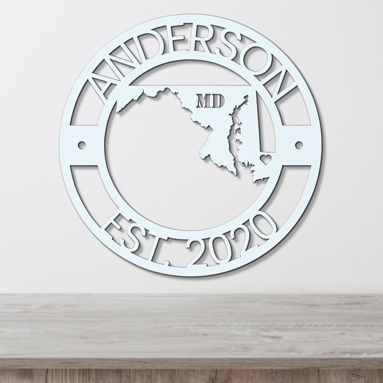 a metal wall clock with the state of mississippi in the center