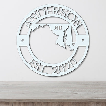 a metal wall clock with the state of mississippi in the center