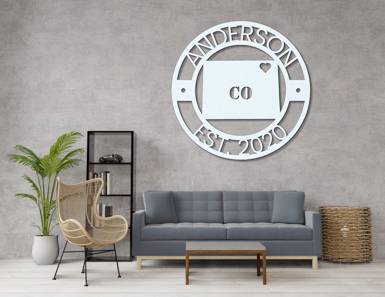 a living room with a gray couch and a white clock