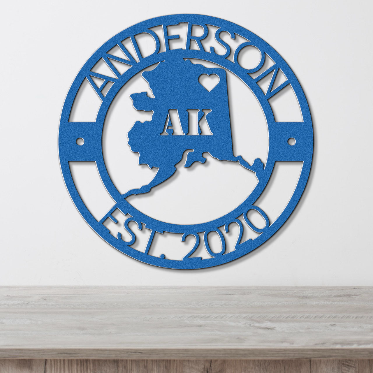 a blue metal sign that says anderson ak est 2010