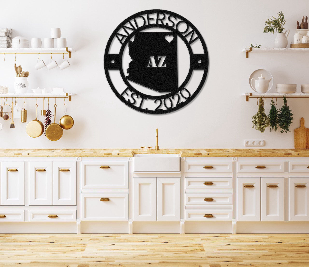 a kitchen with white cabinets and a black clock