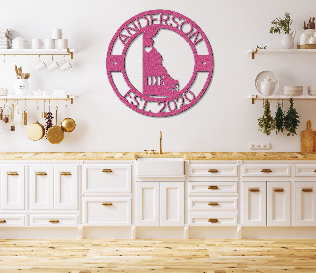 a kitchen with white cabinets and a pink clock