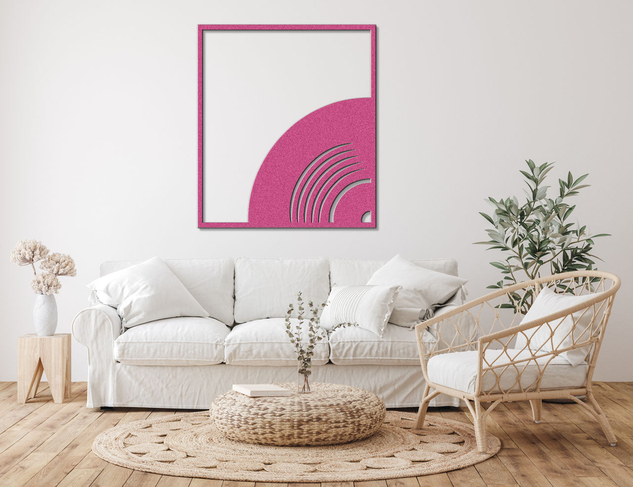 a living room with a white couch and a pink painting