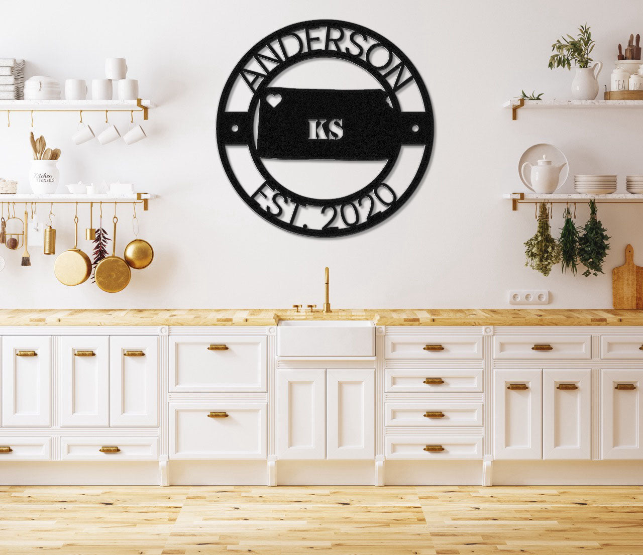 a kitchen with white cabinets and a black clock