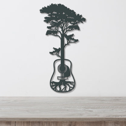 a metal tree with a guitar hanging from it