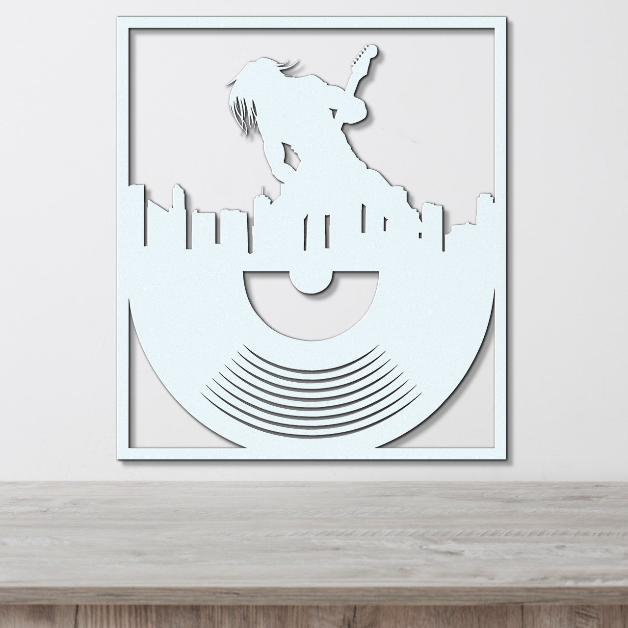 a paper cut of a man on top of a record player