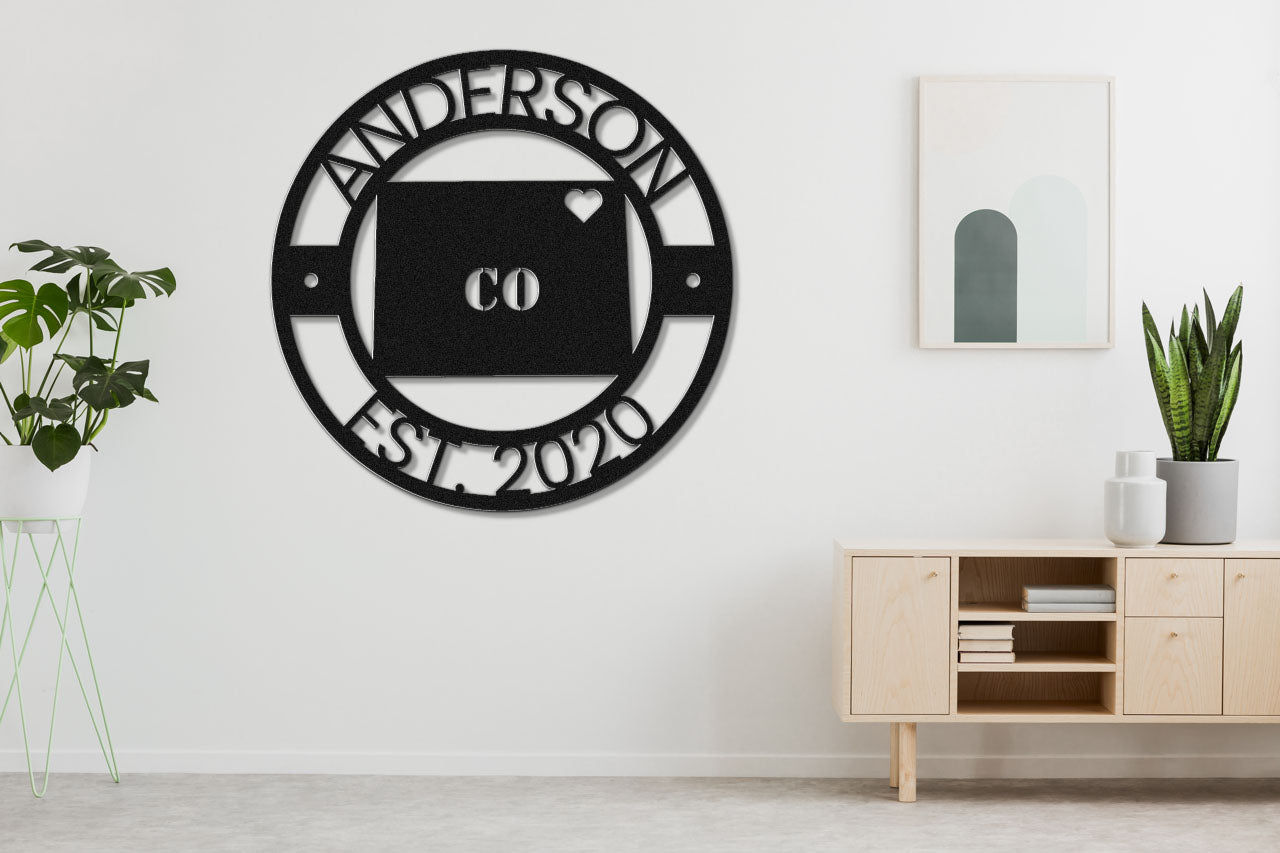 a black and white clock on the wall of a room