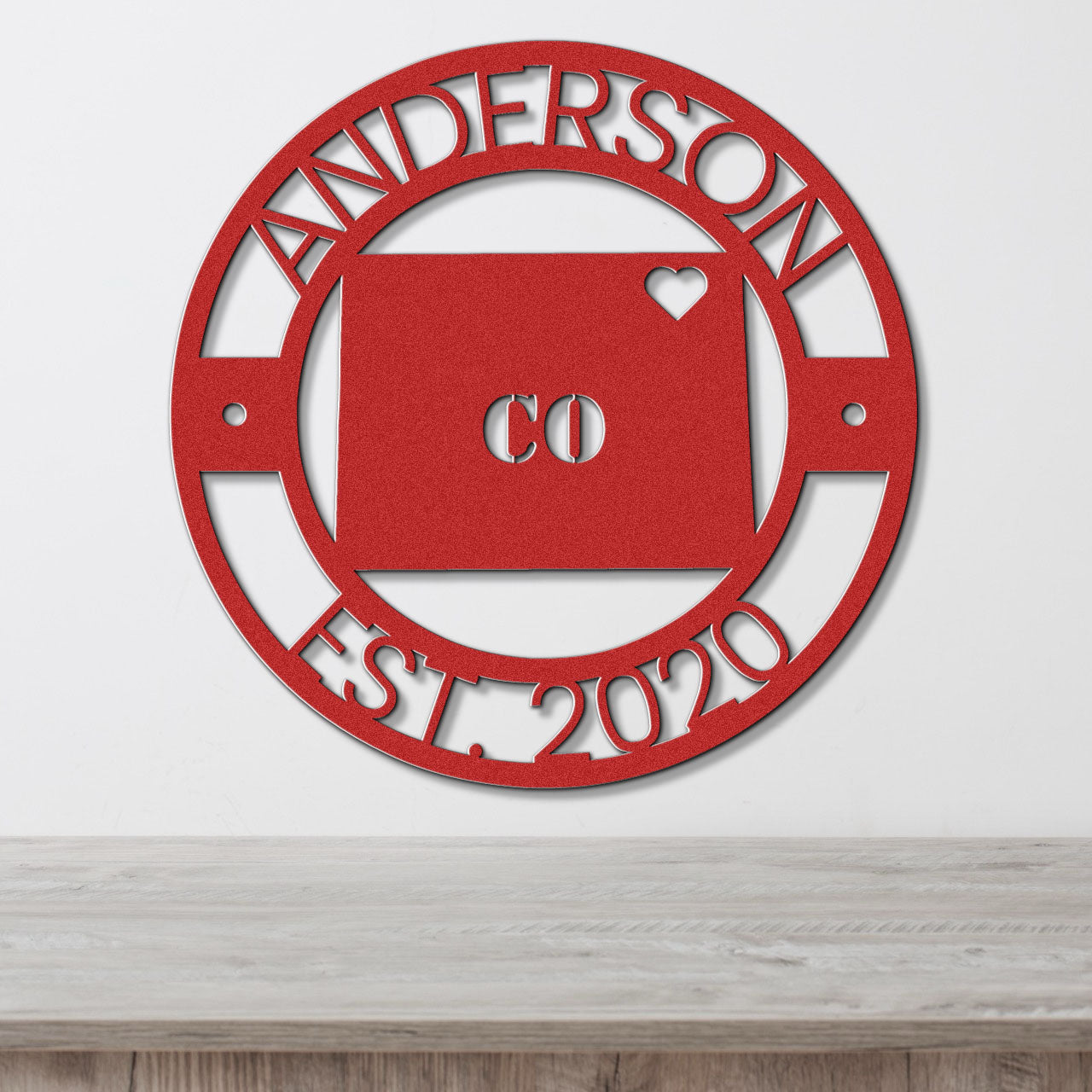 a red metal sign that says anderson est 2010