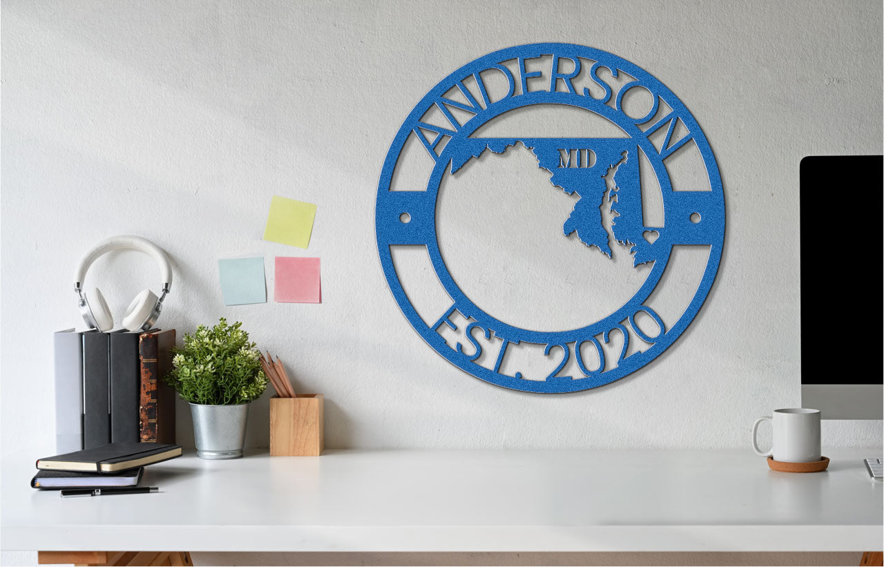 a blue metal wall clock on a white wall