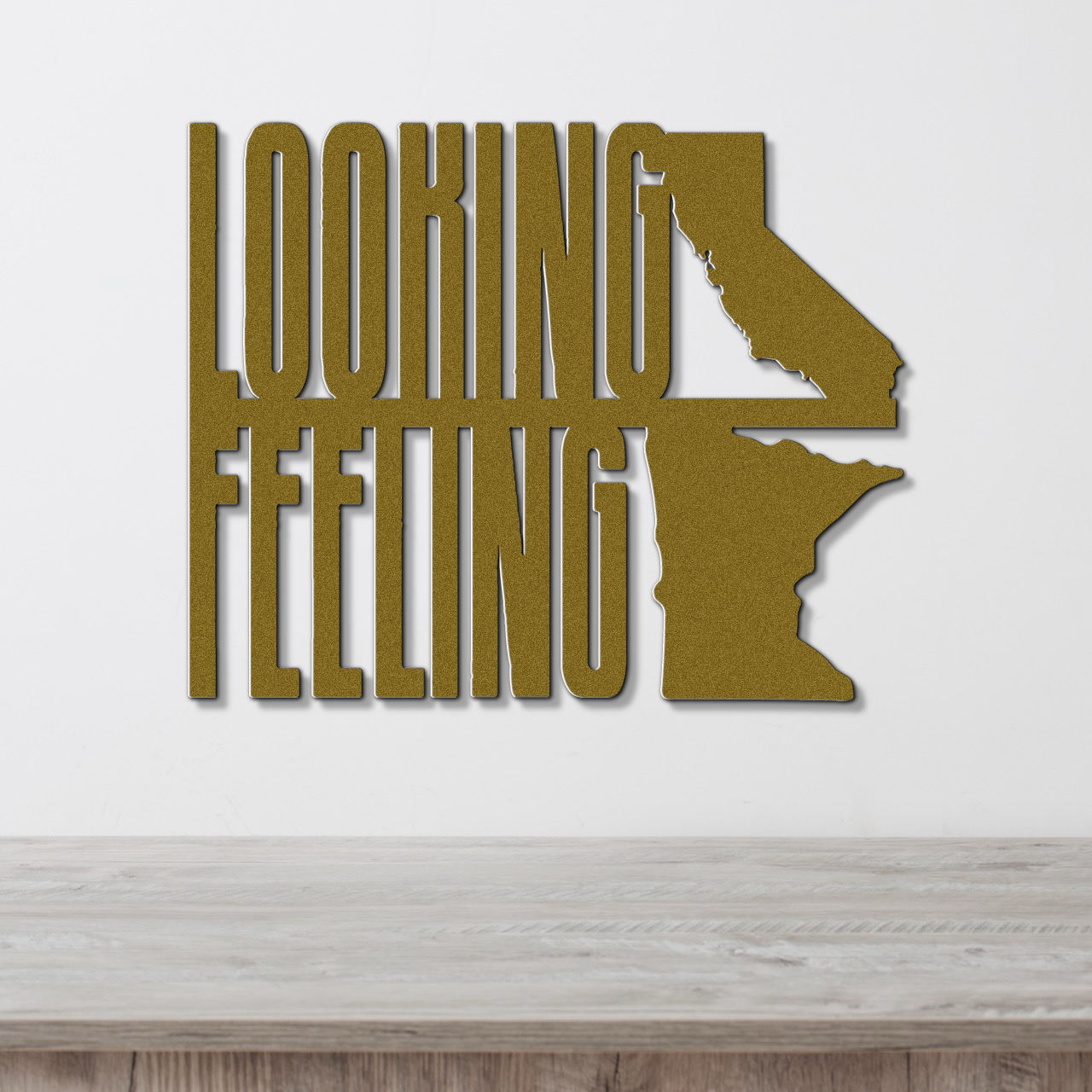 a wooden table with a metal sign that says looking feeling