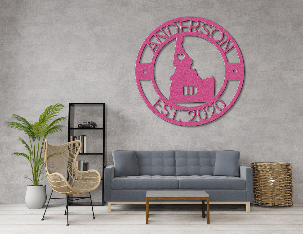 a living room with a gray couch and a pink clock