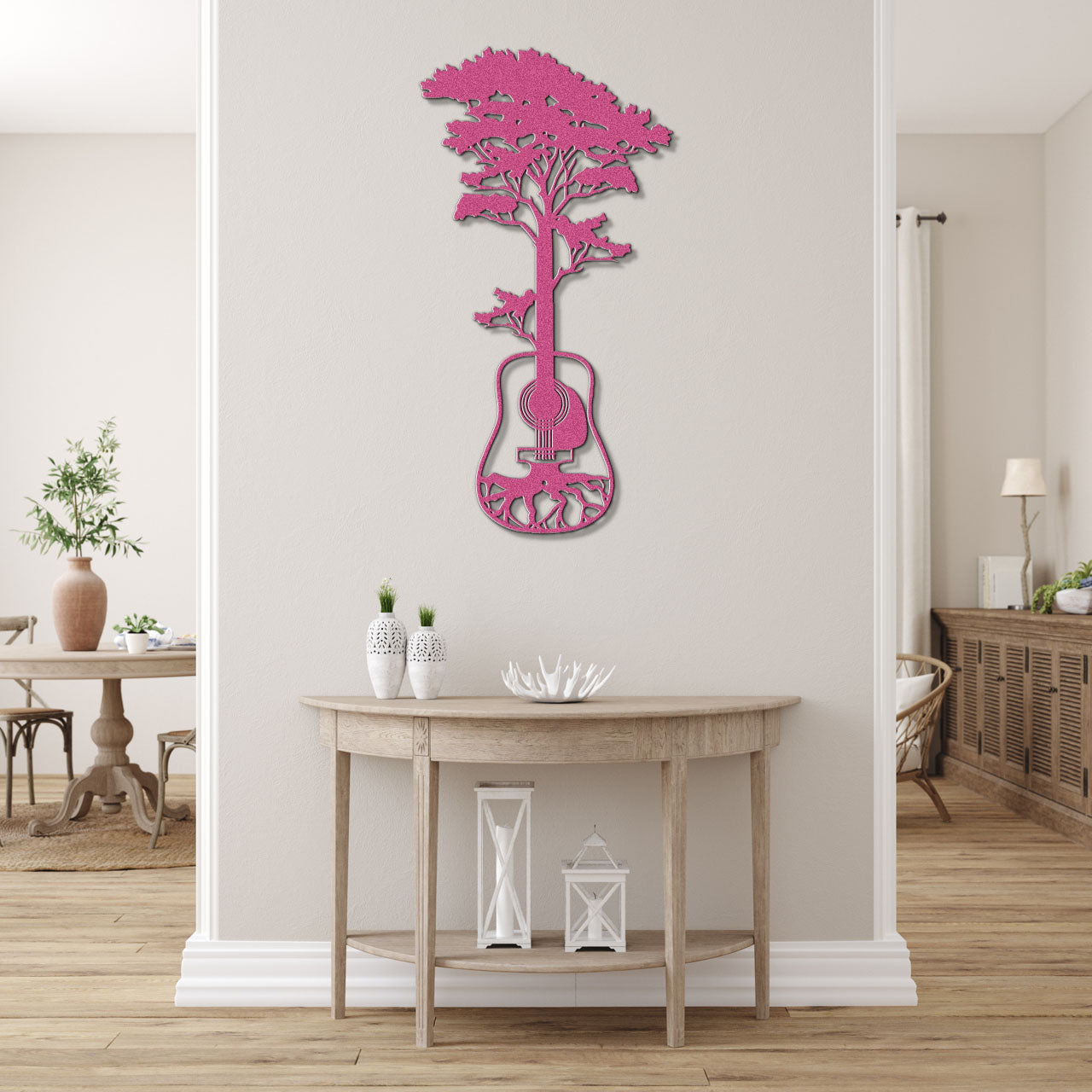 a pink guitar shaped wall clock on a white wall